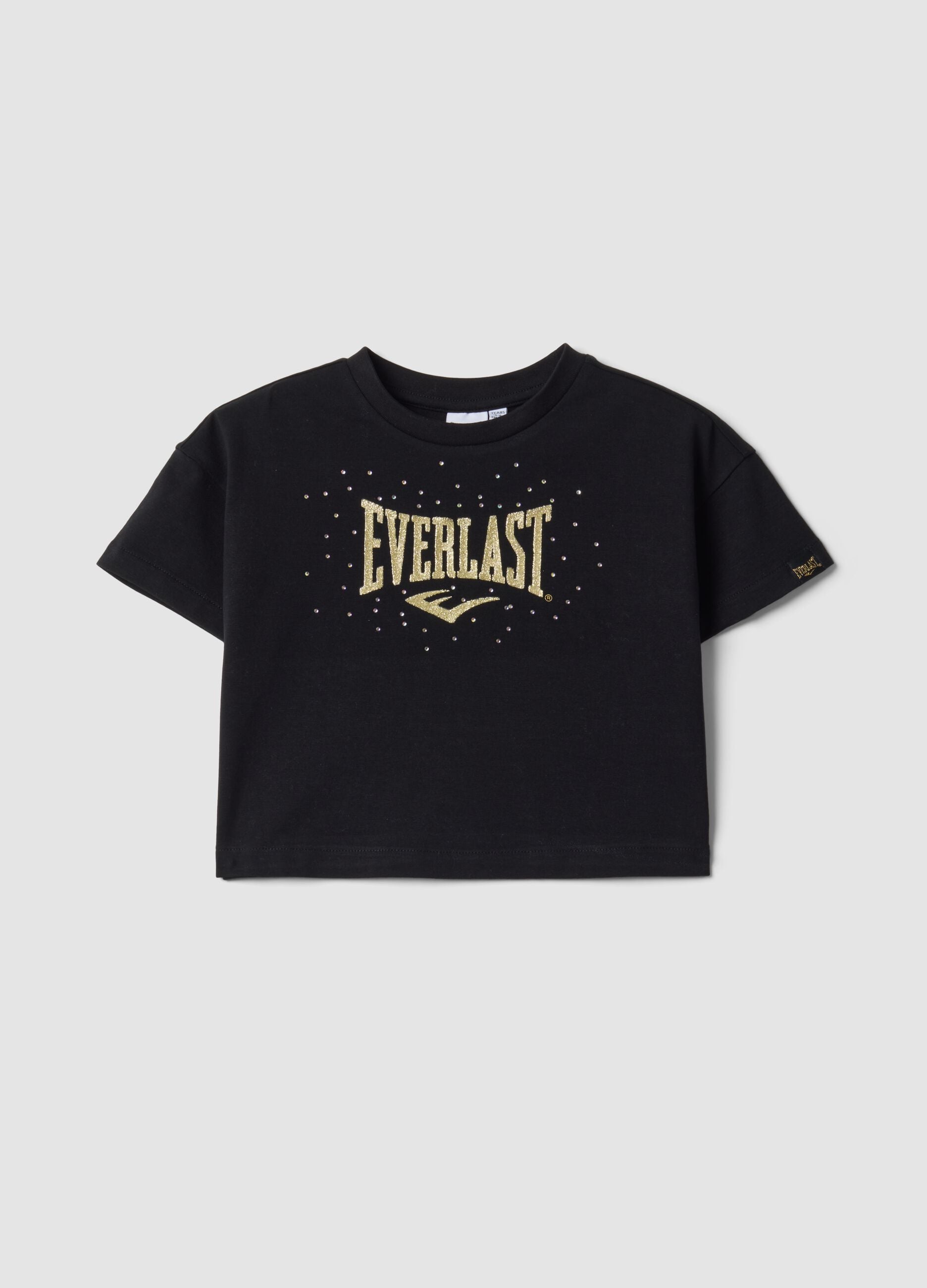 Camiseta cropped negra de algod&oacute;n el&aacute;stico con estampado para ni&ntilde;a