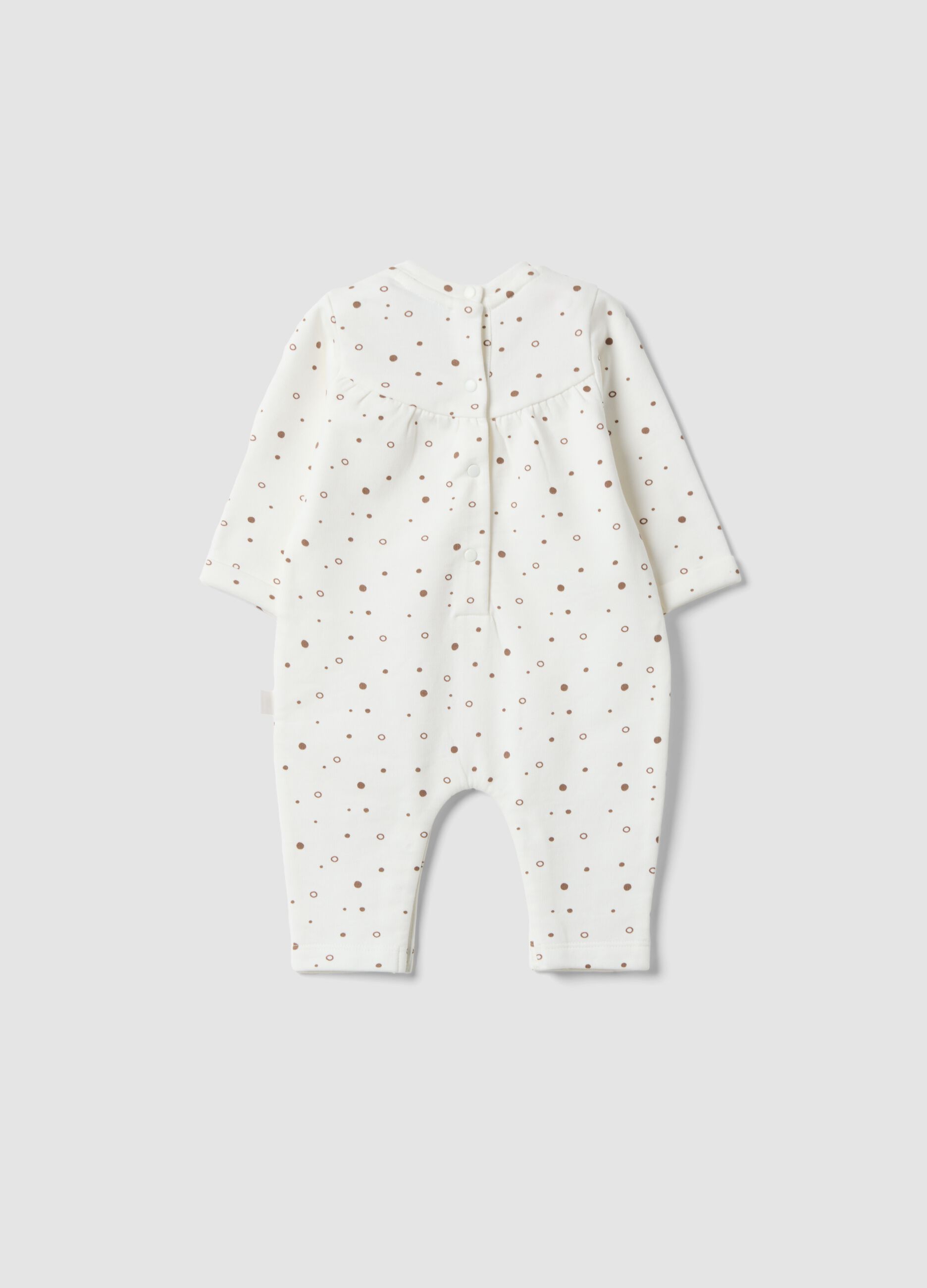Babygrow branco em algod&atilde;o org&acirc;nico puro &agrave;s bolinhas