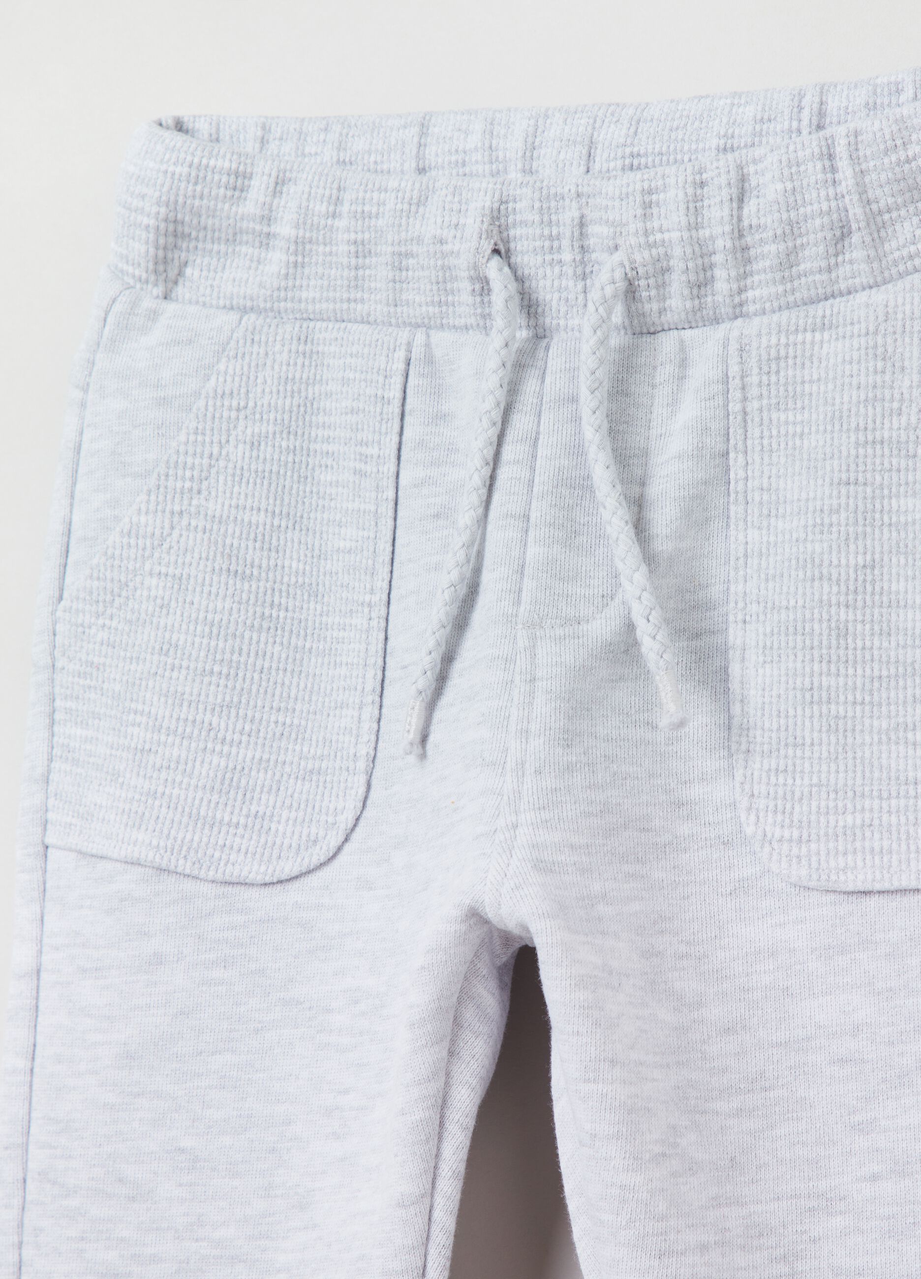 Joggers with drawstring and waffle detailing.