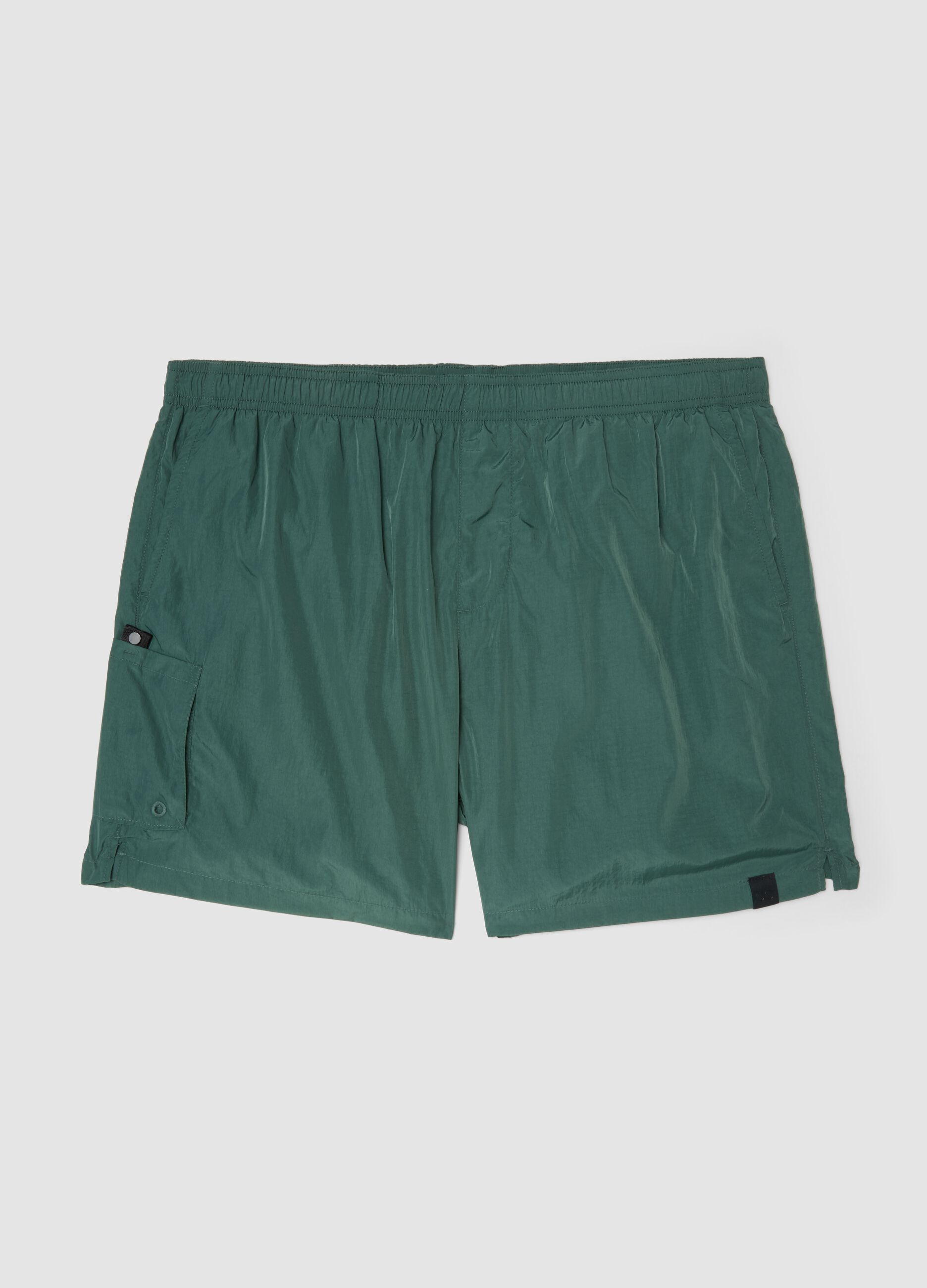 Green swim shorts with elasticated waistband