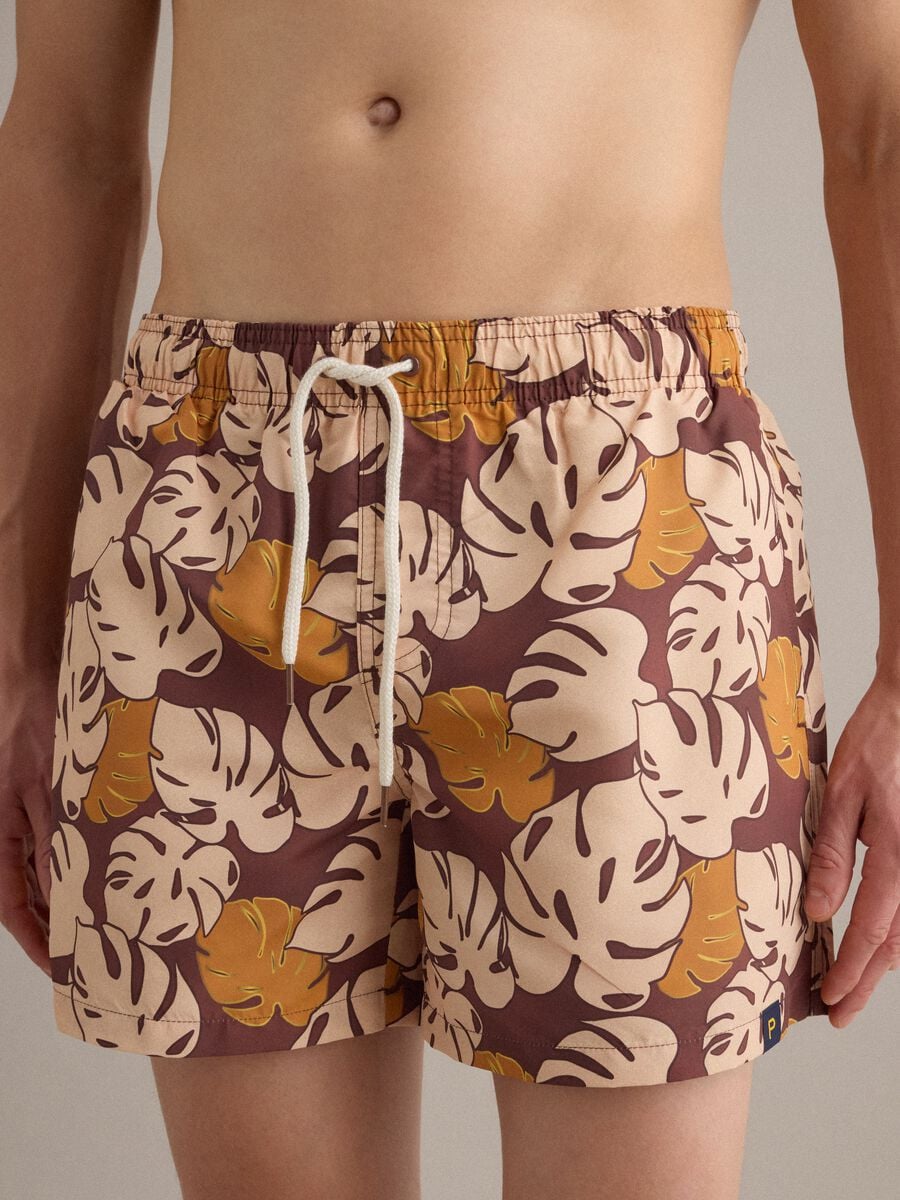 Brown tropical-print swim shorts_1