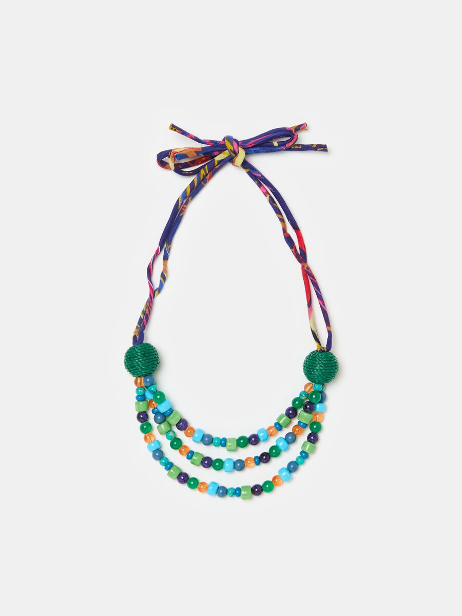 Necklace with coloured gems and laces_0