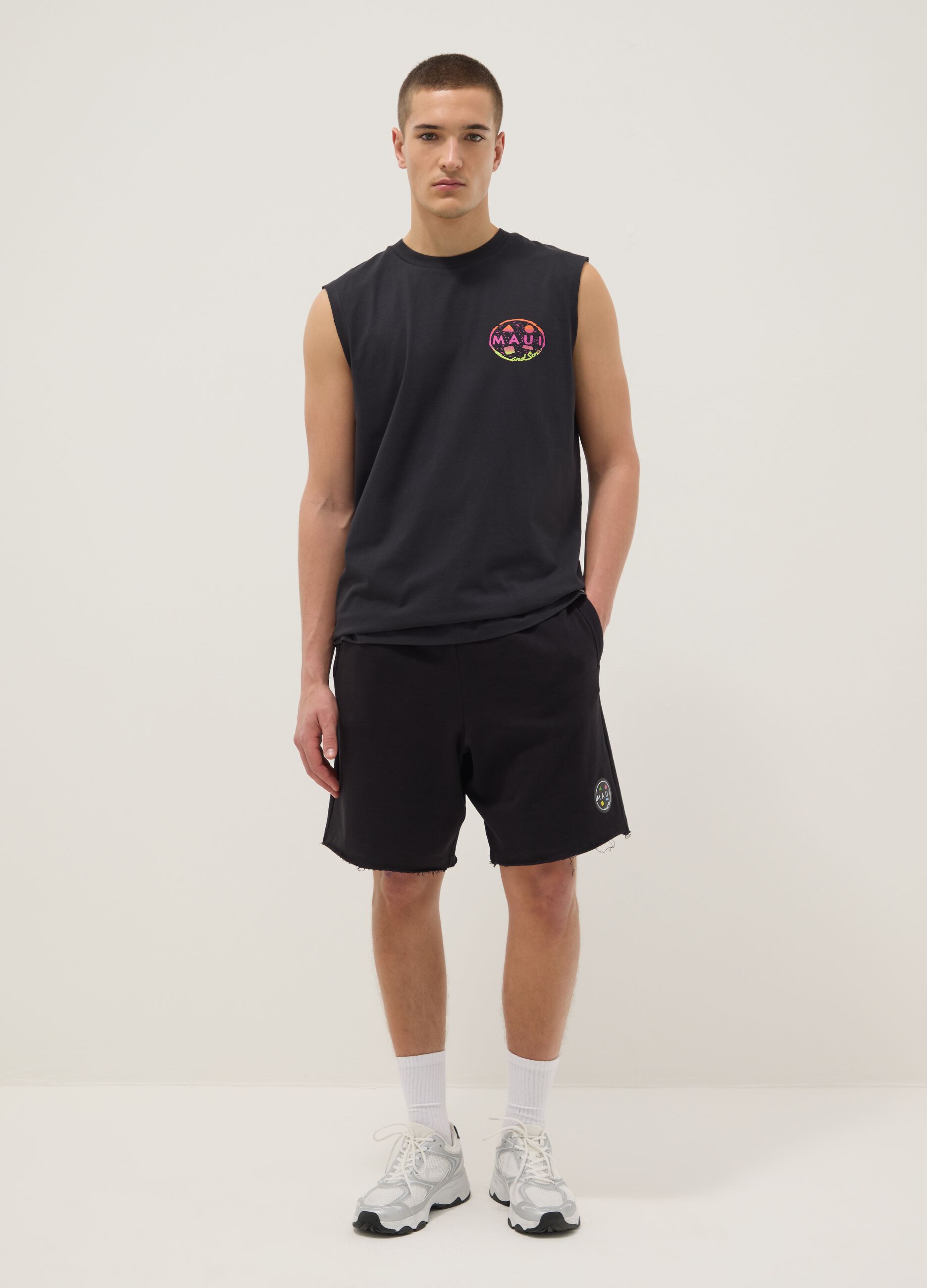 Black pure cotton relaxed-fit Bermuda shorts with raw-cut hems