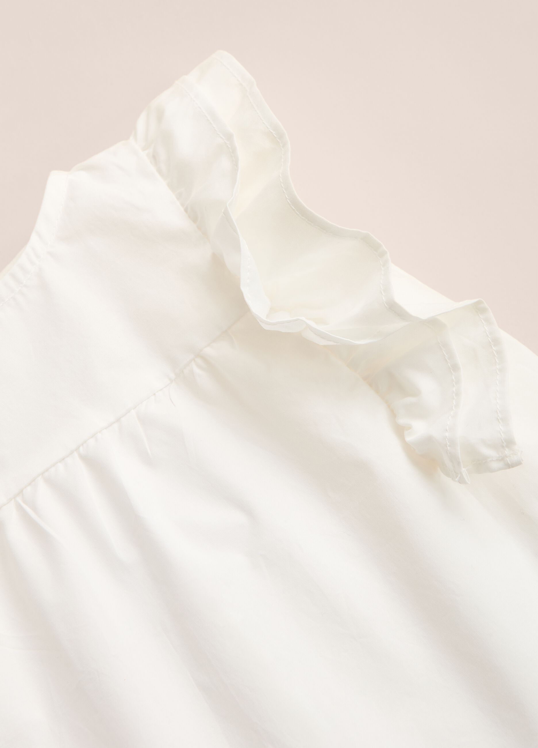 IANA 100% cotton sleeveless shirt with ruffles.