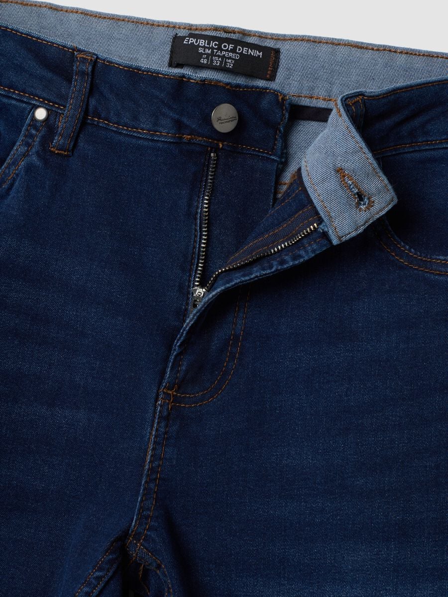Dark blue stretch cotton slim tapered fit jeans_1