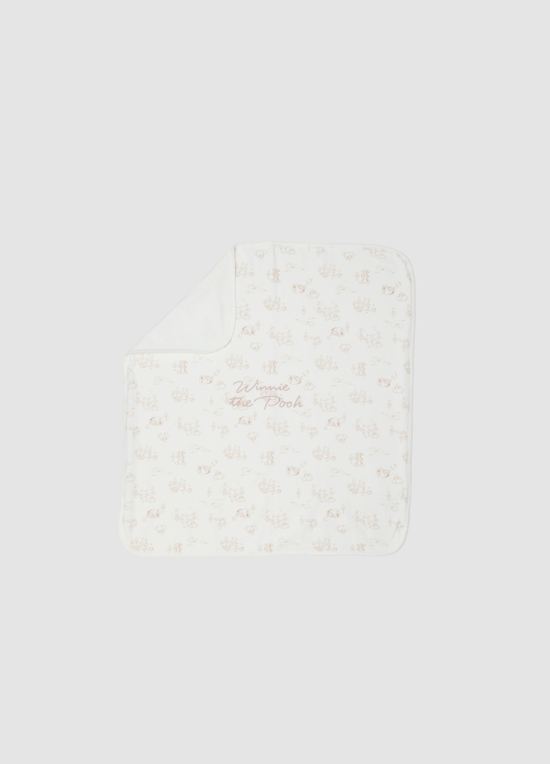 White organic cotton baby blanket with Winnie-the-Pooh