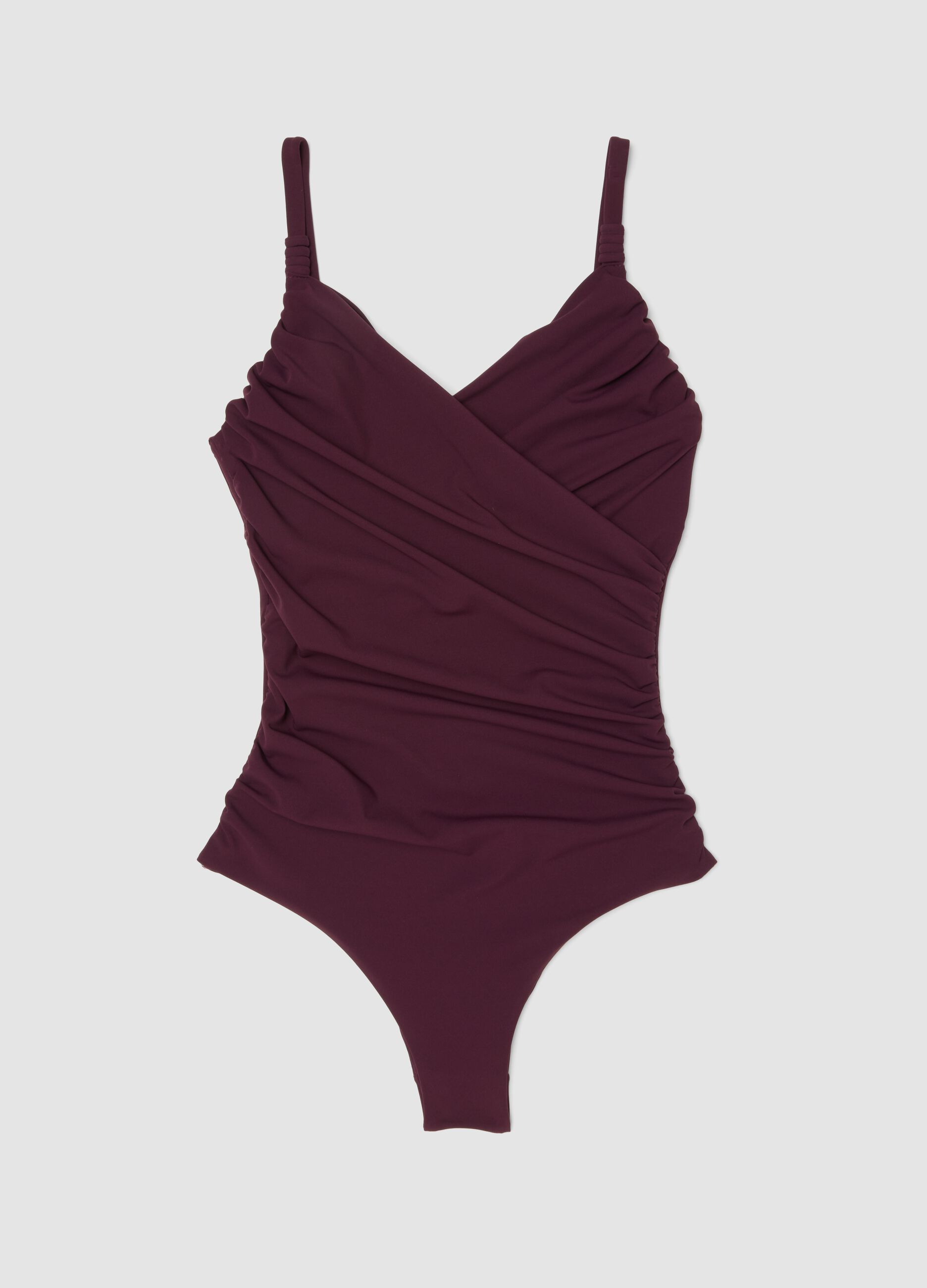Purple draped stretch swimsuit with shaping effect