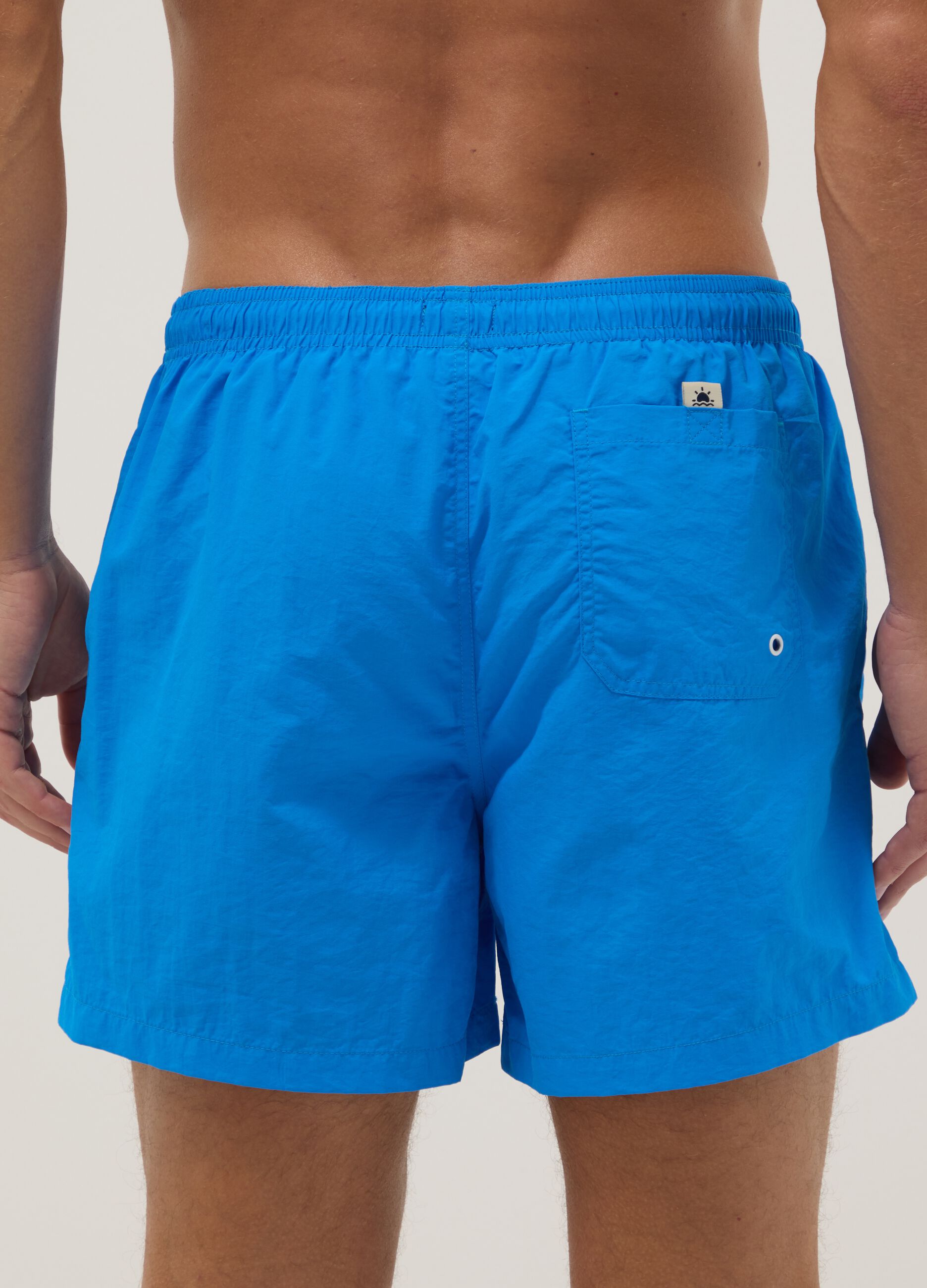 Blue swim shorts with elasticated waistband