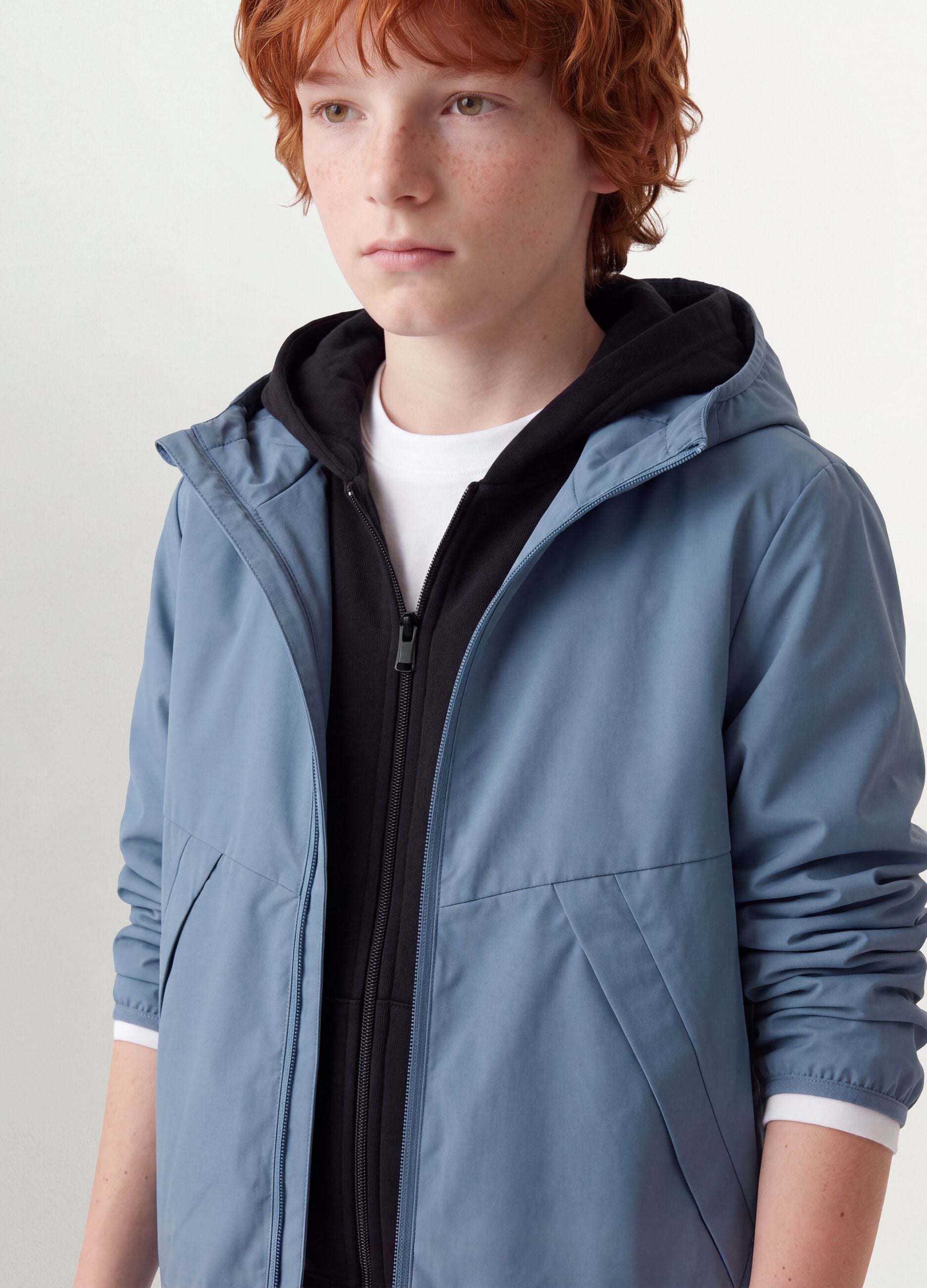 Blue oversized rain jacket with hood and zip for boys