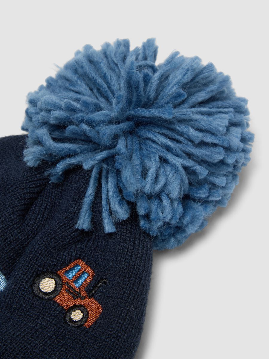 Blue knitted hat with pompom and tractor embroidery_2