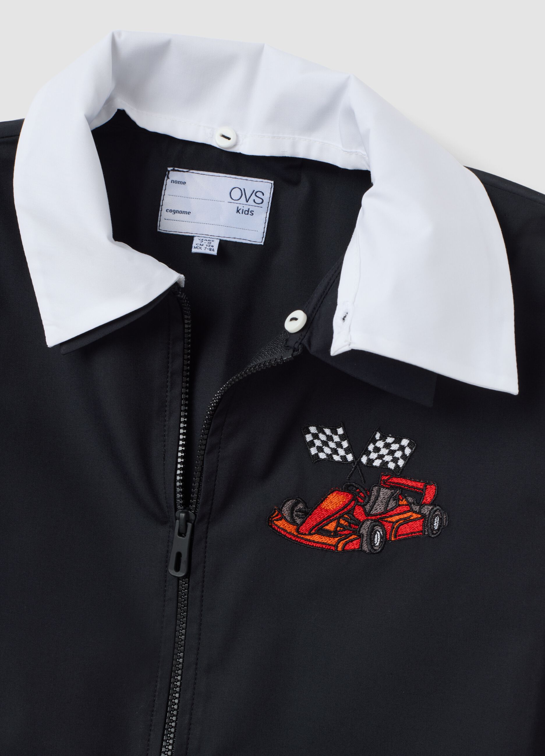 Black school apron with zip and go-kart embroidery for boys