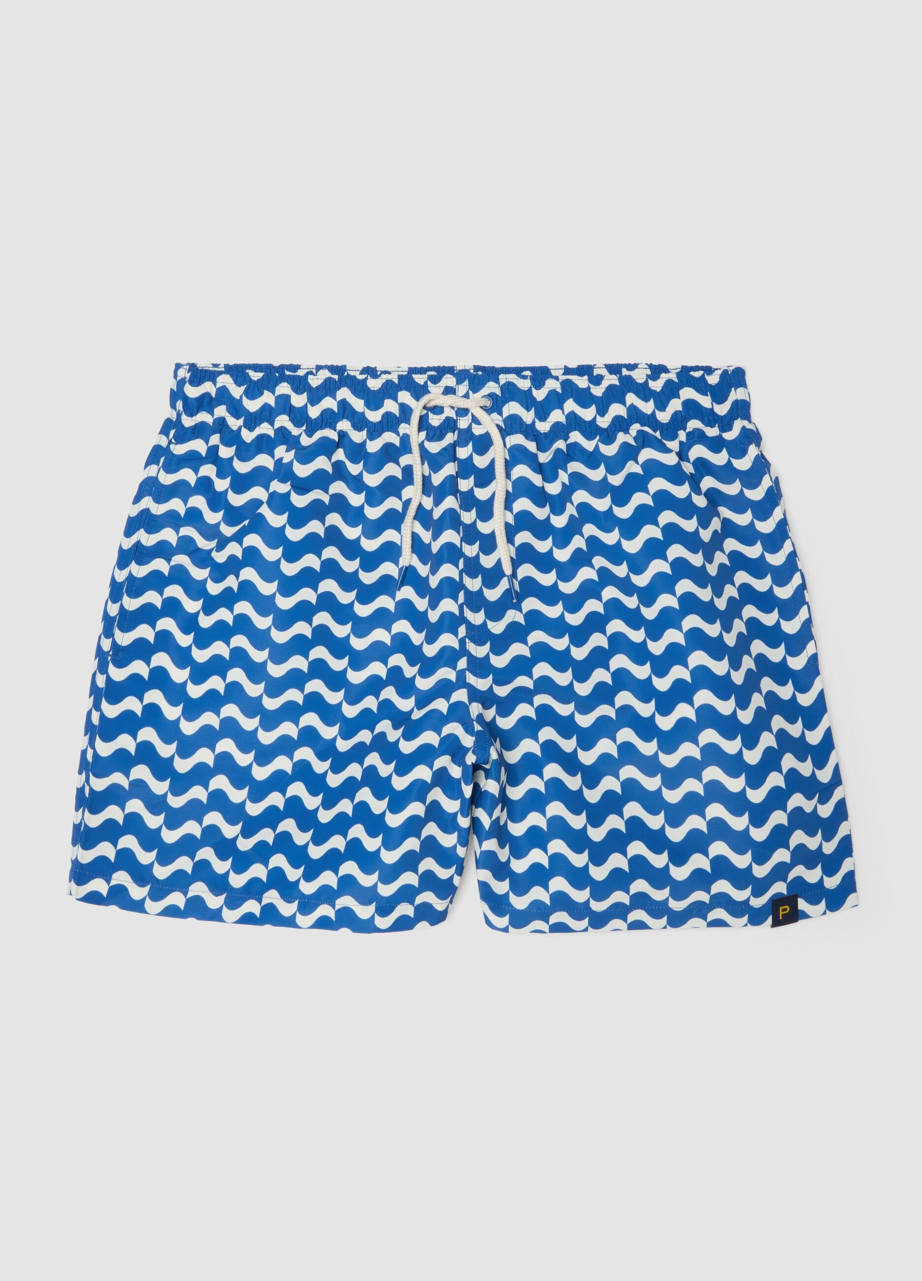 Blue swim shorts with wave pattern