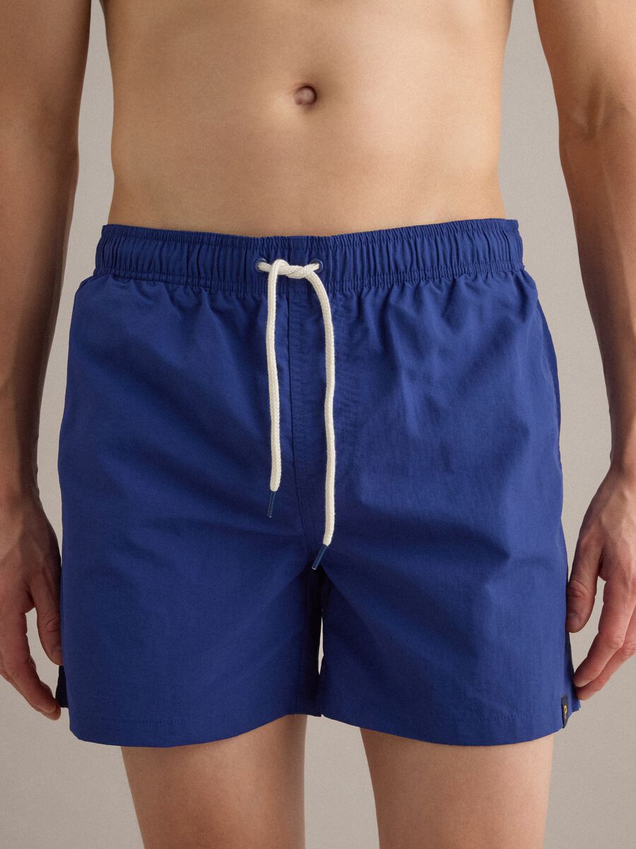 Blue swim shorts with elasticated waist and drawstring_2