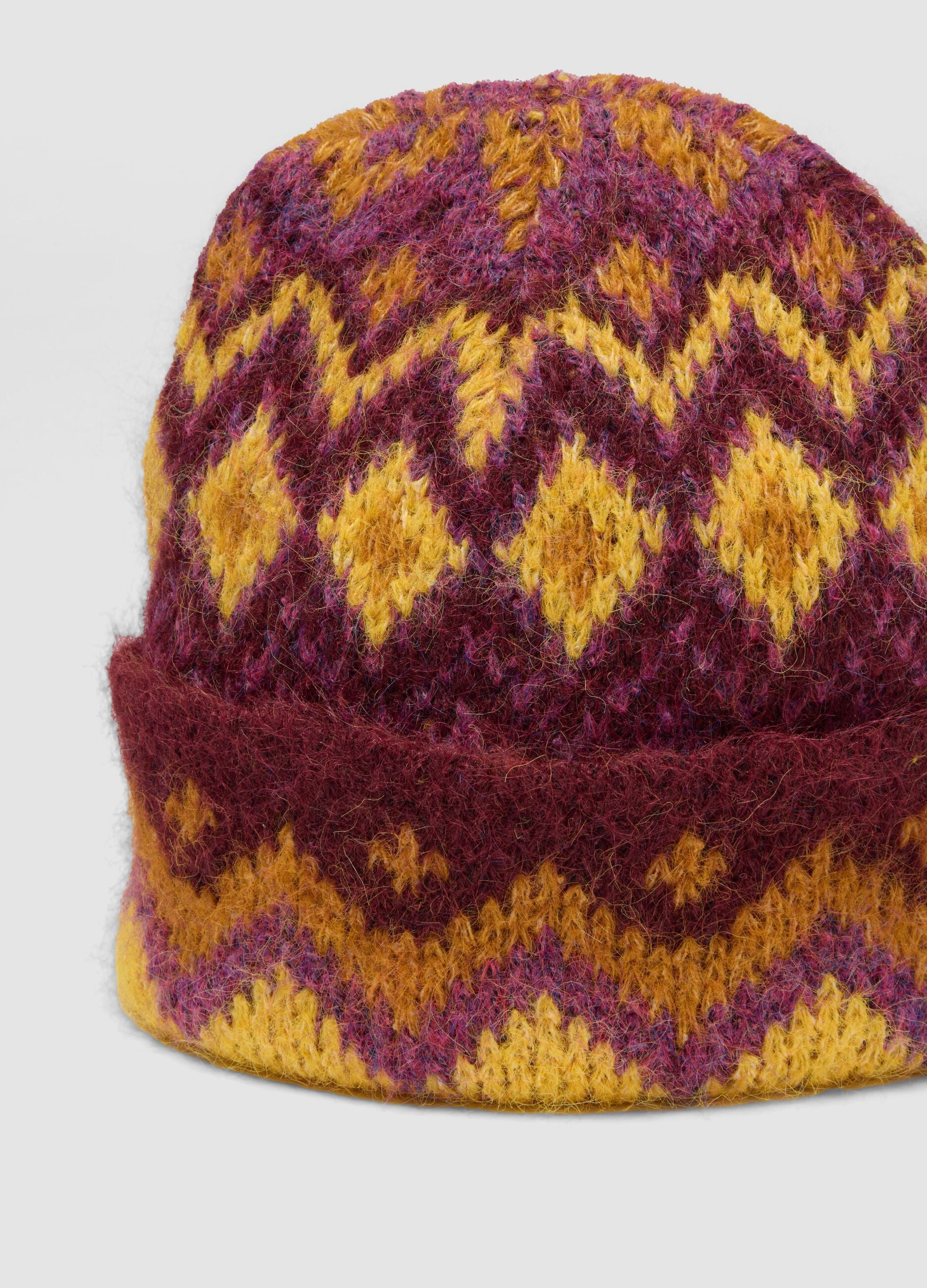 Cappello giallo e viola in lana elasticizzata jacquard