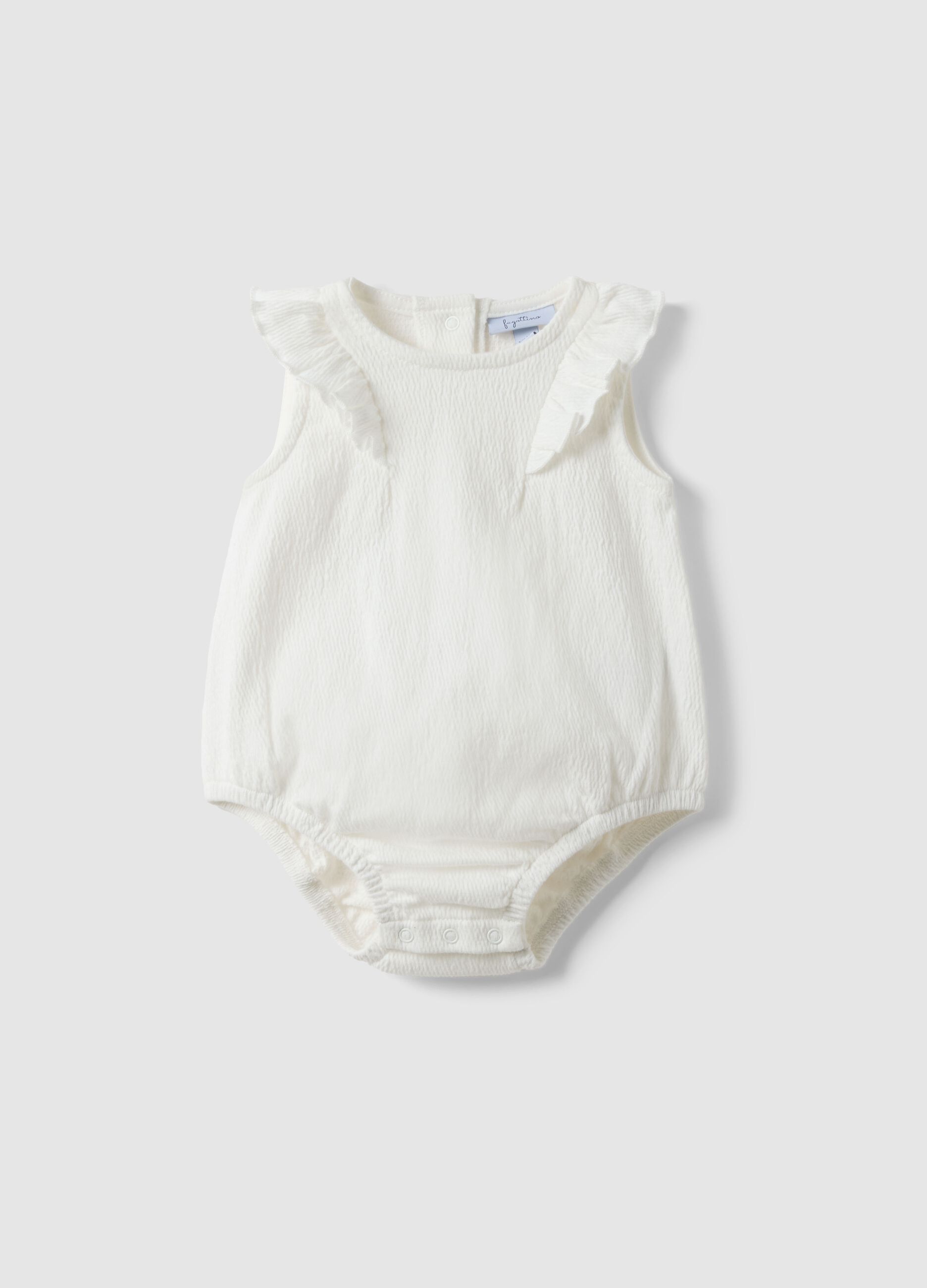 White baby body with ruffles in organic cotton blend