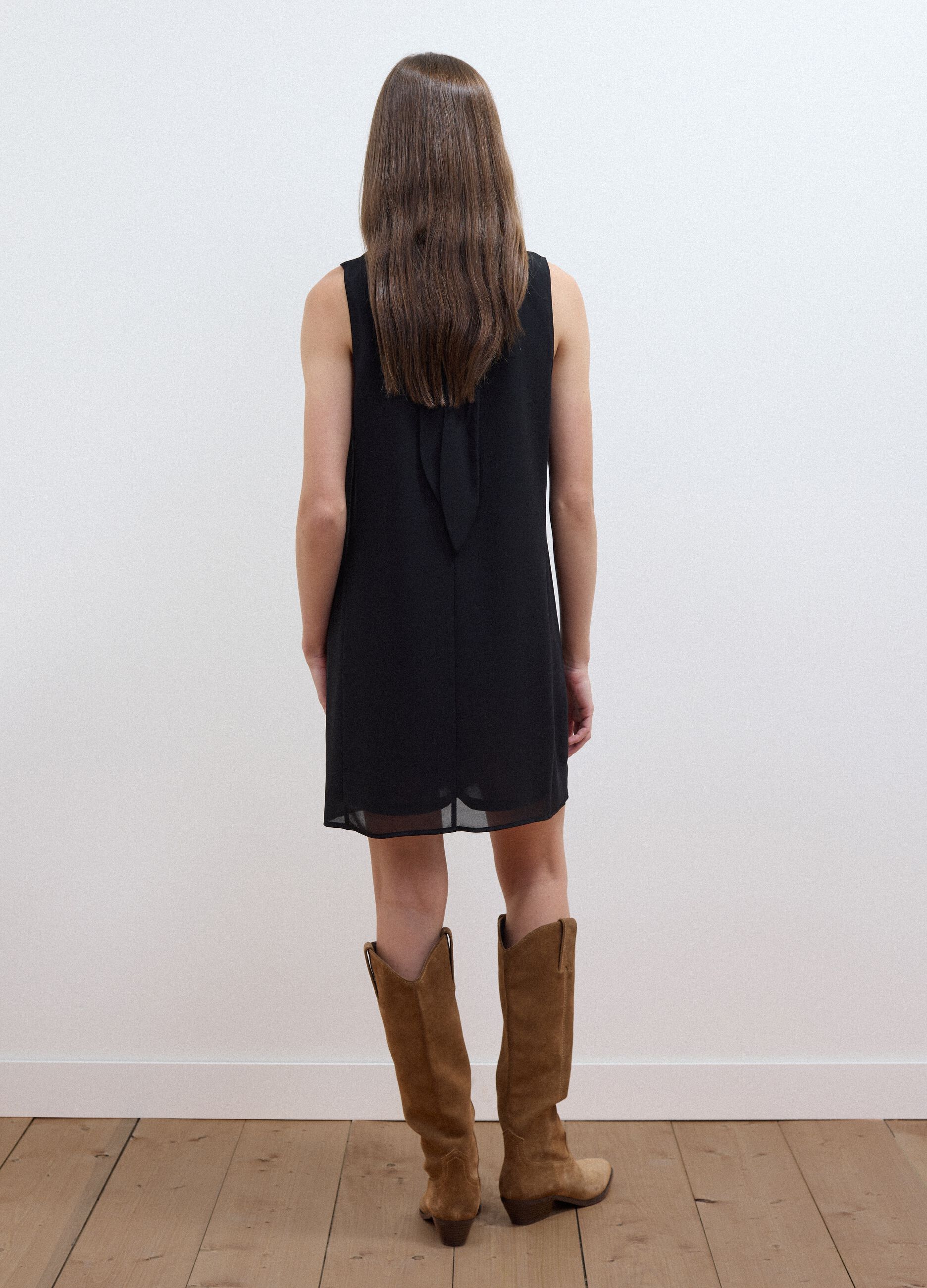 Black sleeveless high-neck slim-fit dress with bow
