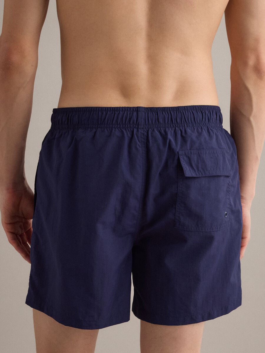 Blue swim shorts with elasticated waistband and drawstring_4