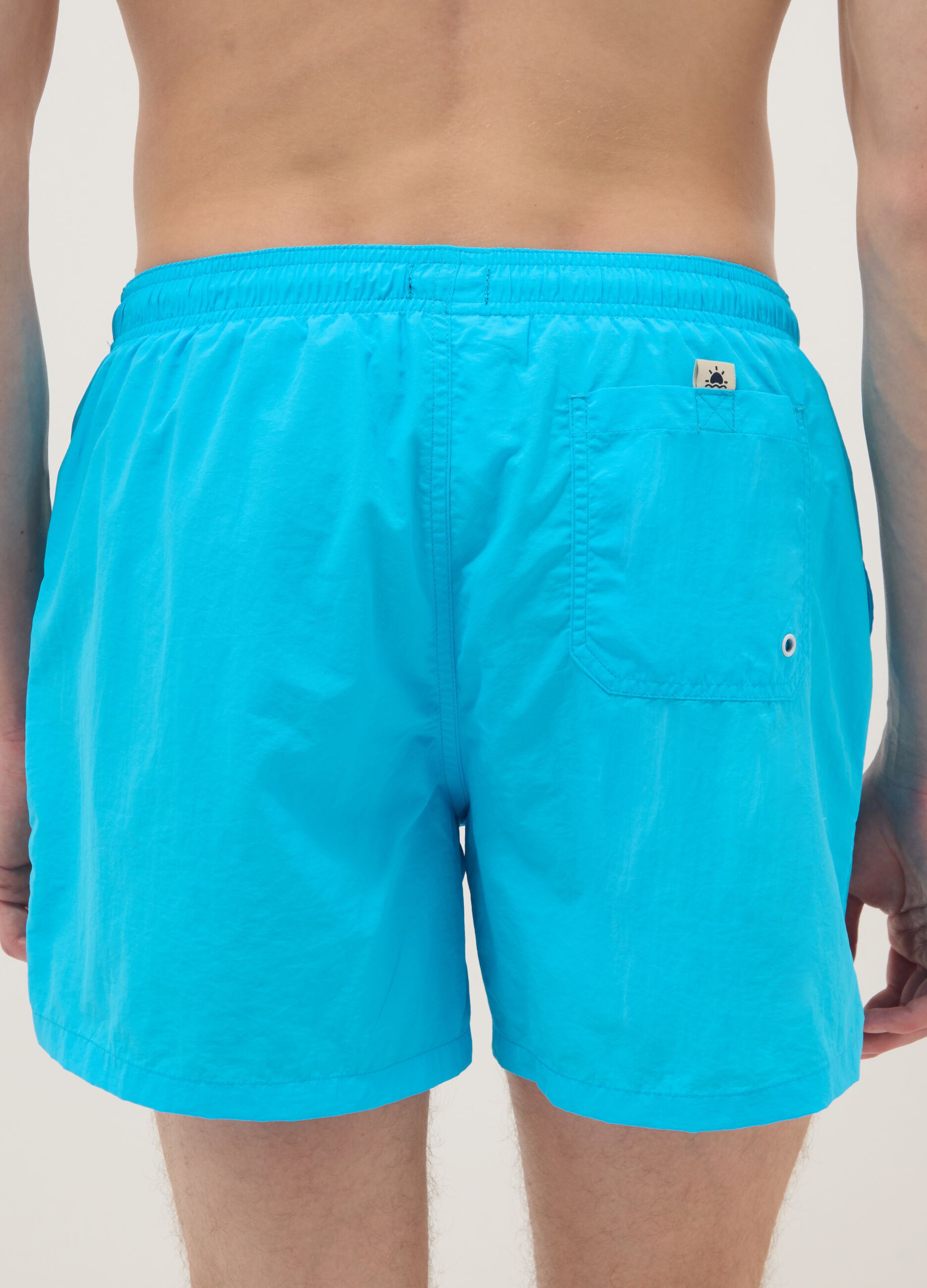 Blue swim shorts with elasticated waist