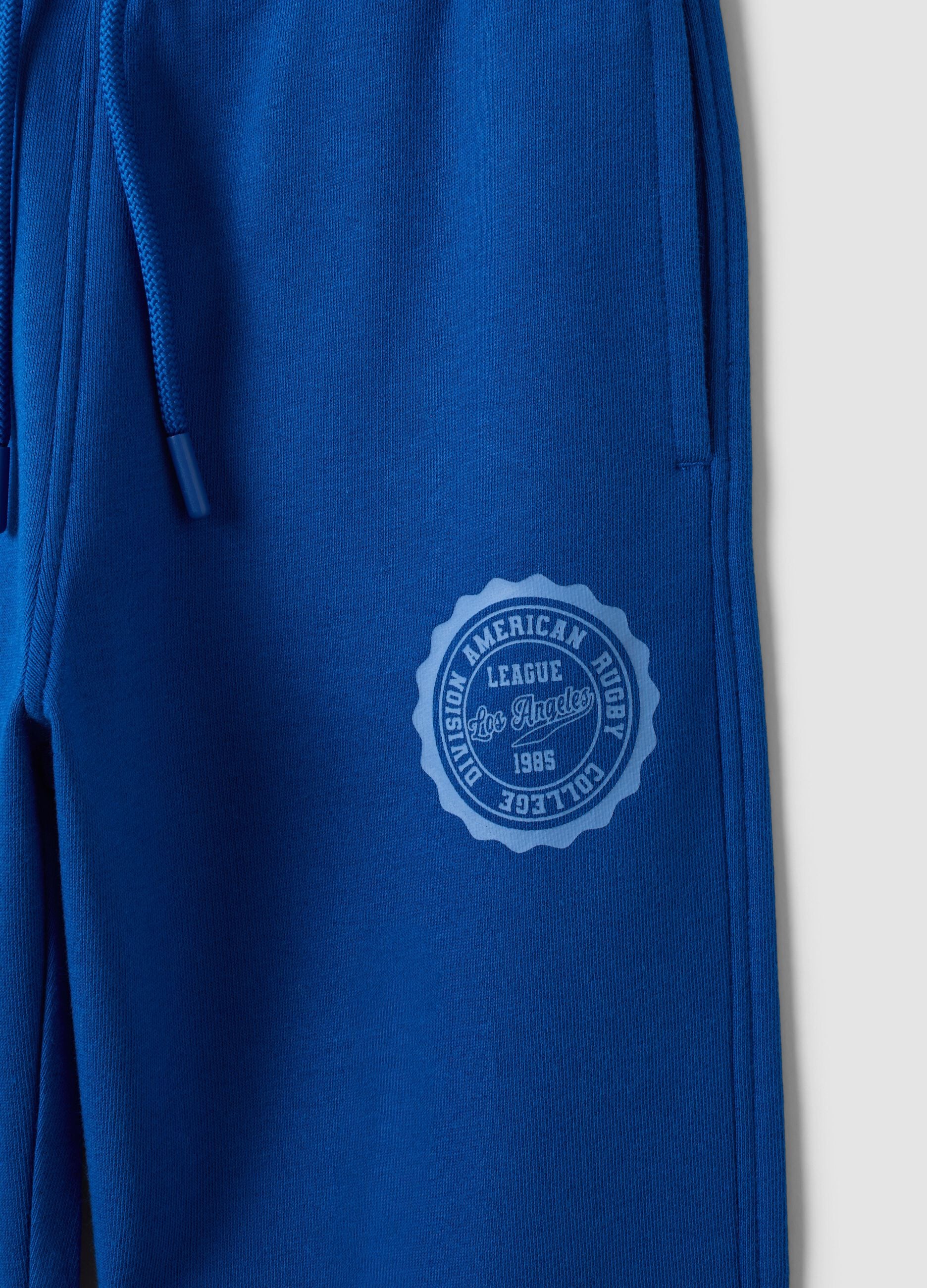 Blue cotton and viscose blend joggers with contrast print for boys