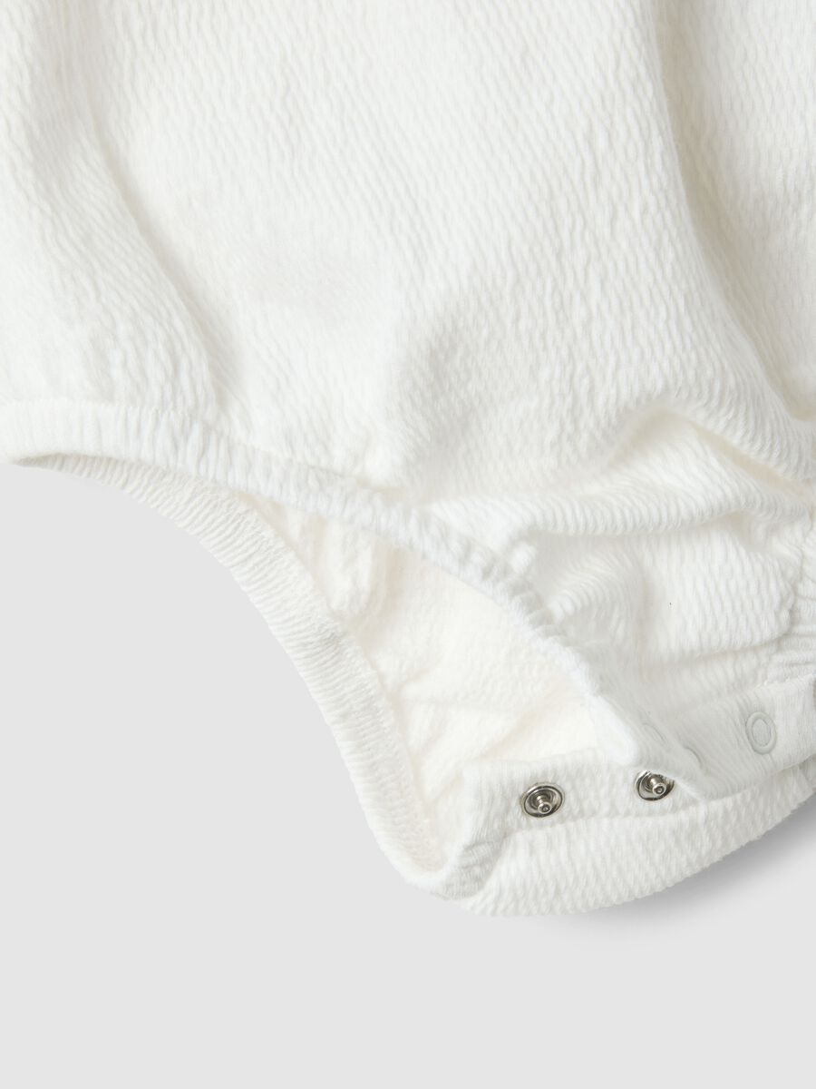 White baby body with ruffles in organic cotton blend_1