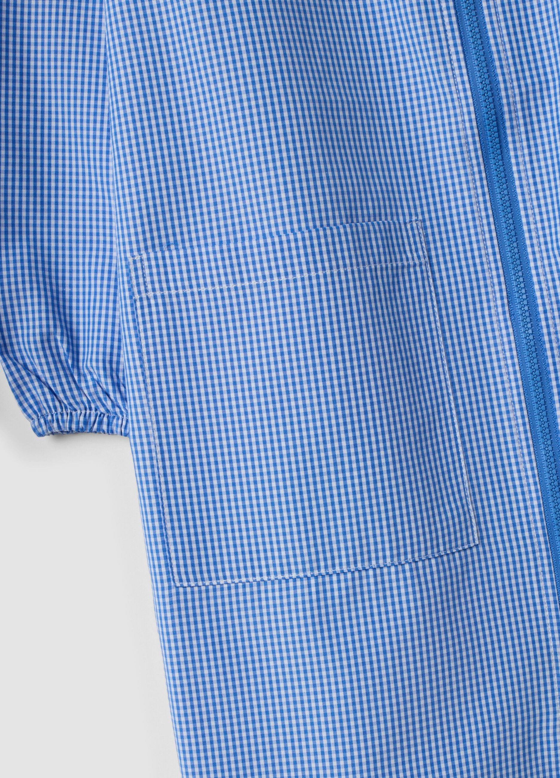 Light blue gingham nursery apron with zip and machine embroidery