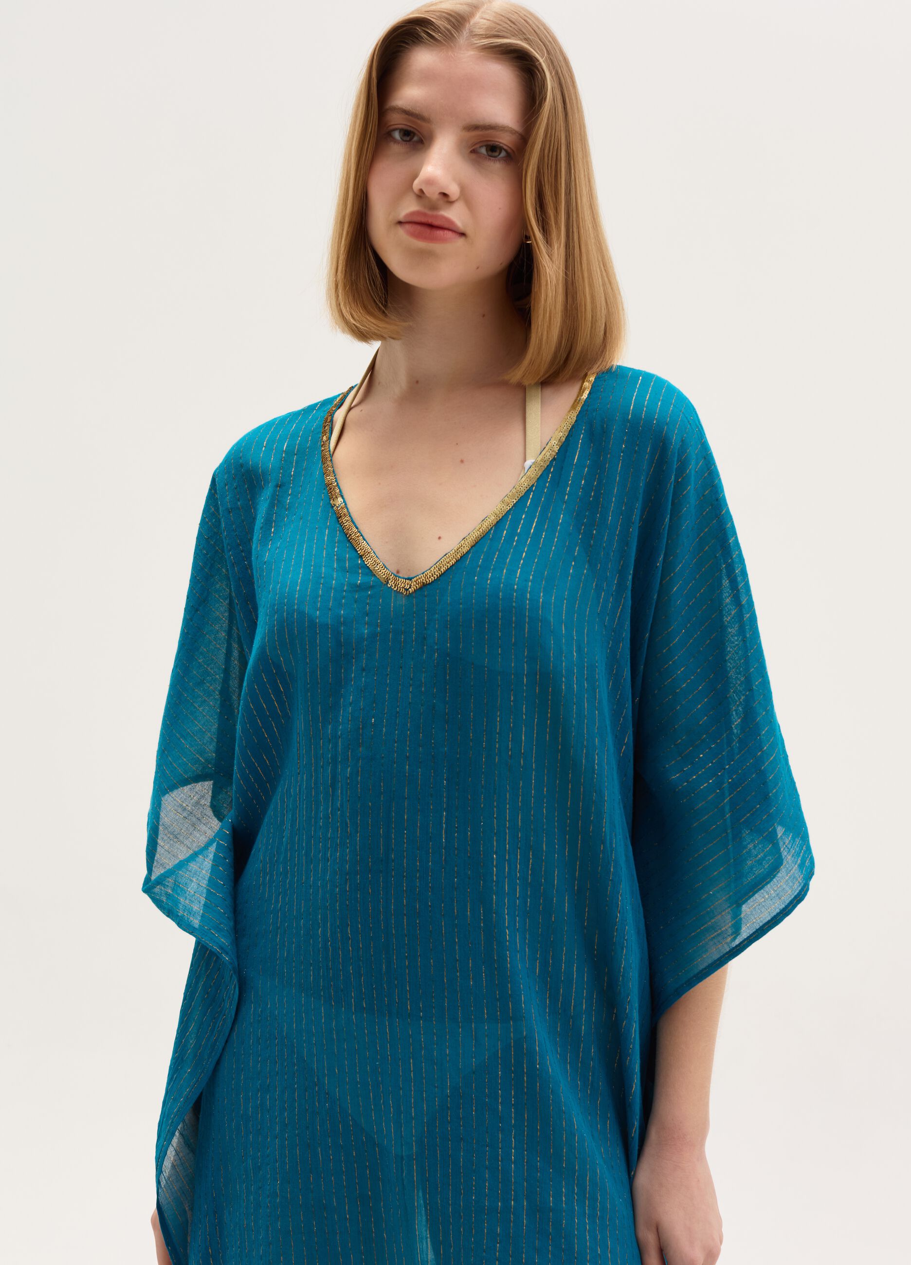 Beach cover-up poncho in lurex and cotton