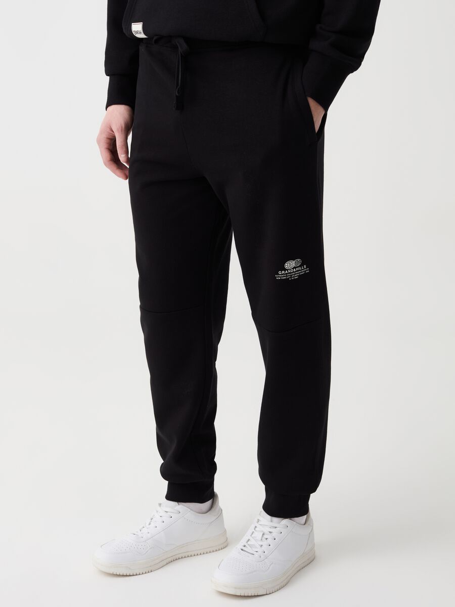 Joggers in felpa con coulisse e stampa_1