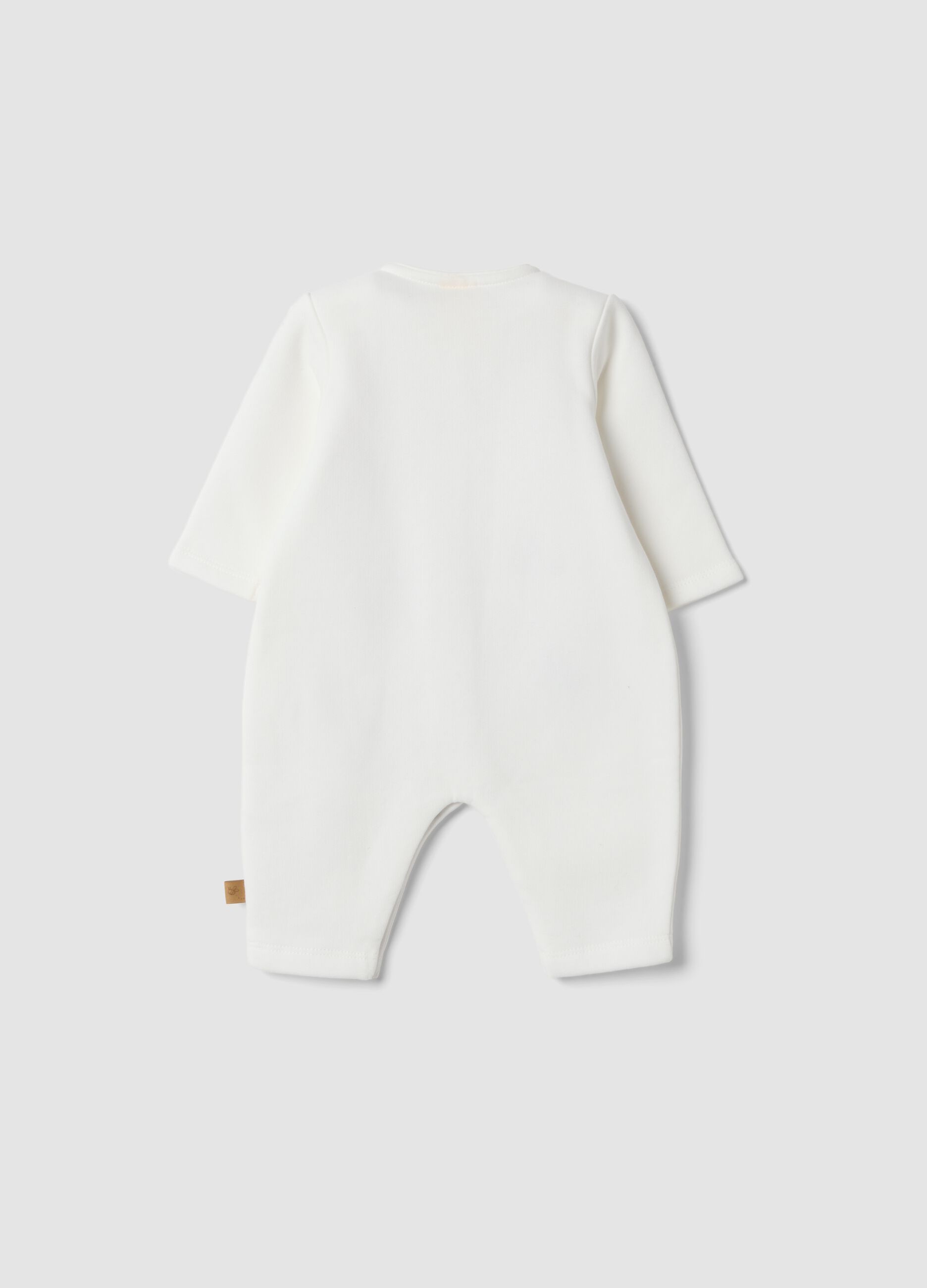 Off-white organic cotton sleepsuit with Winnie the Pooh print