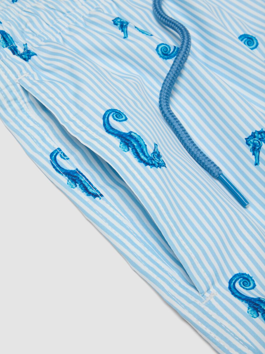 Blue striped swim shorts with seahorse print_1