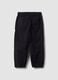 Black stretch cotton jogger trousers for boys_1