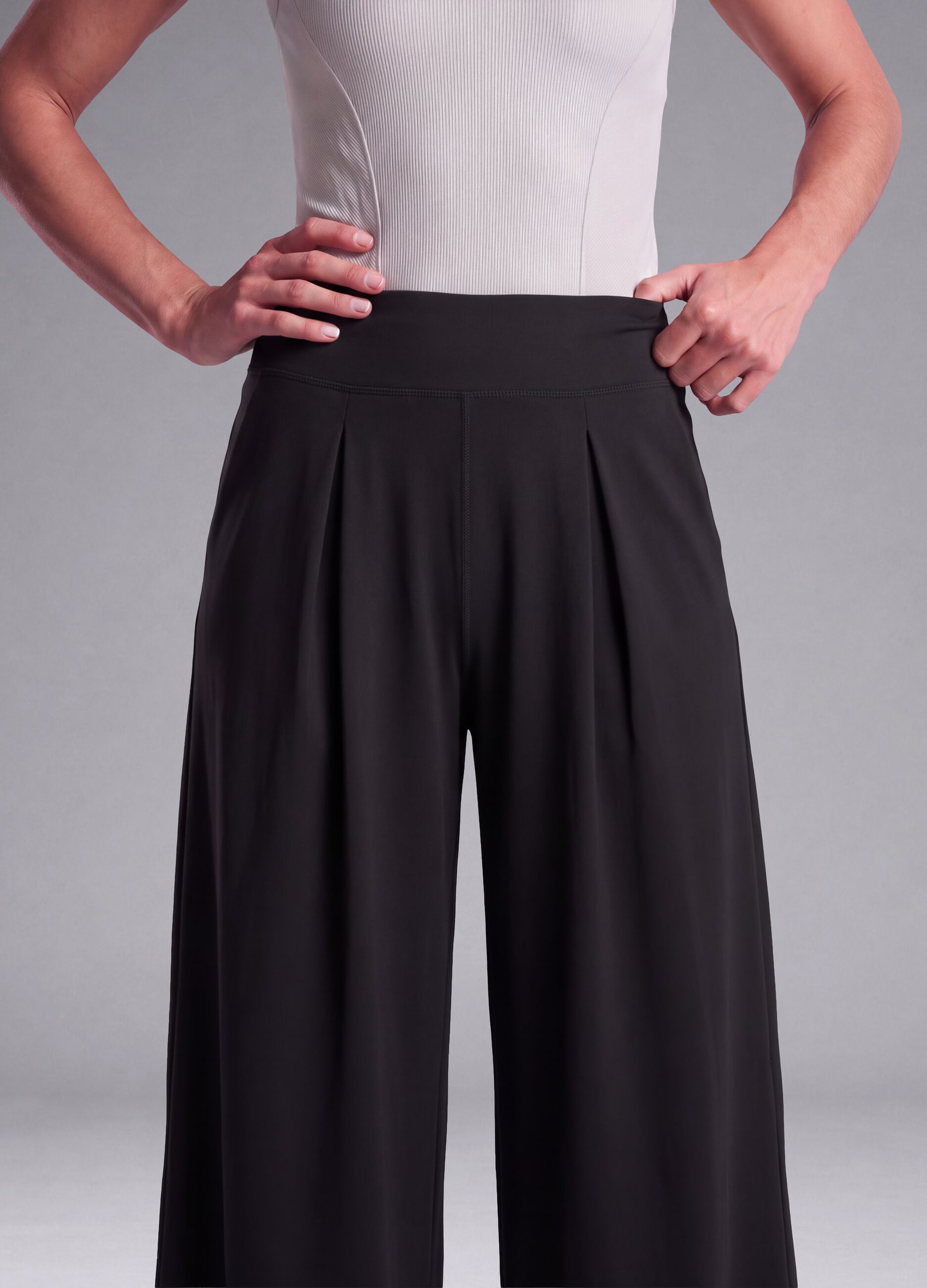 Black wide-leg stretch-fabric trousers