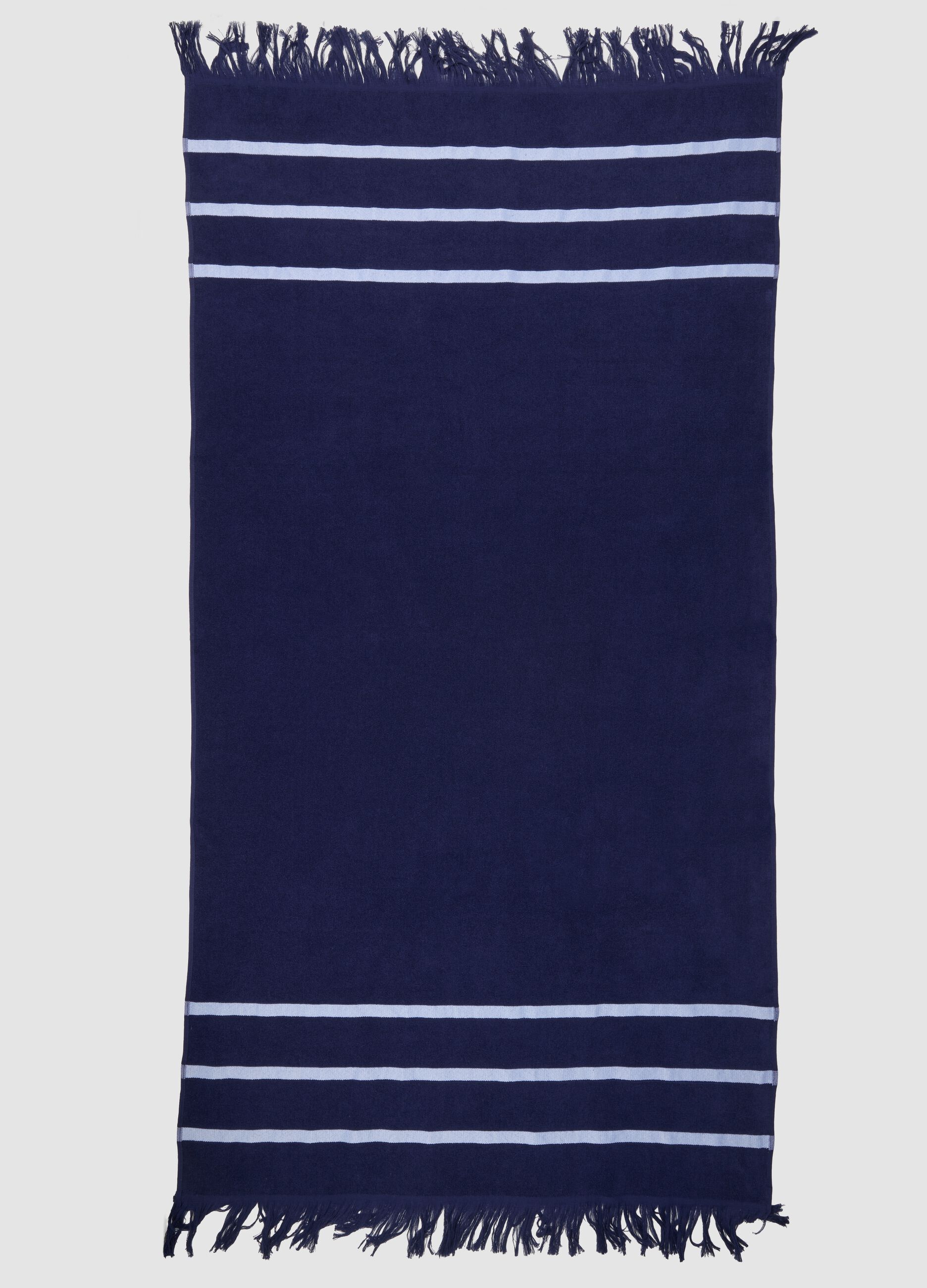 Blue cotton-blend beach towel with fringes