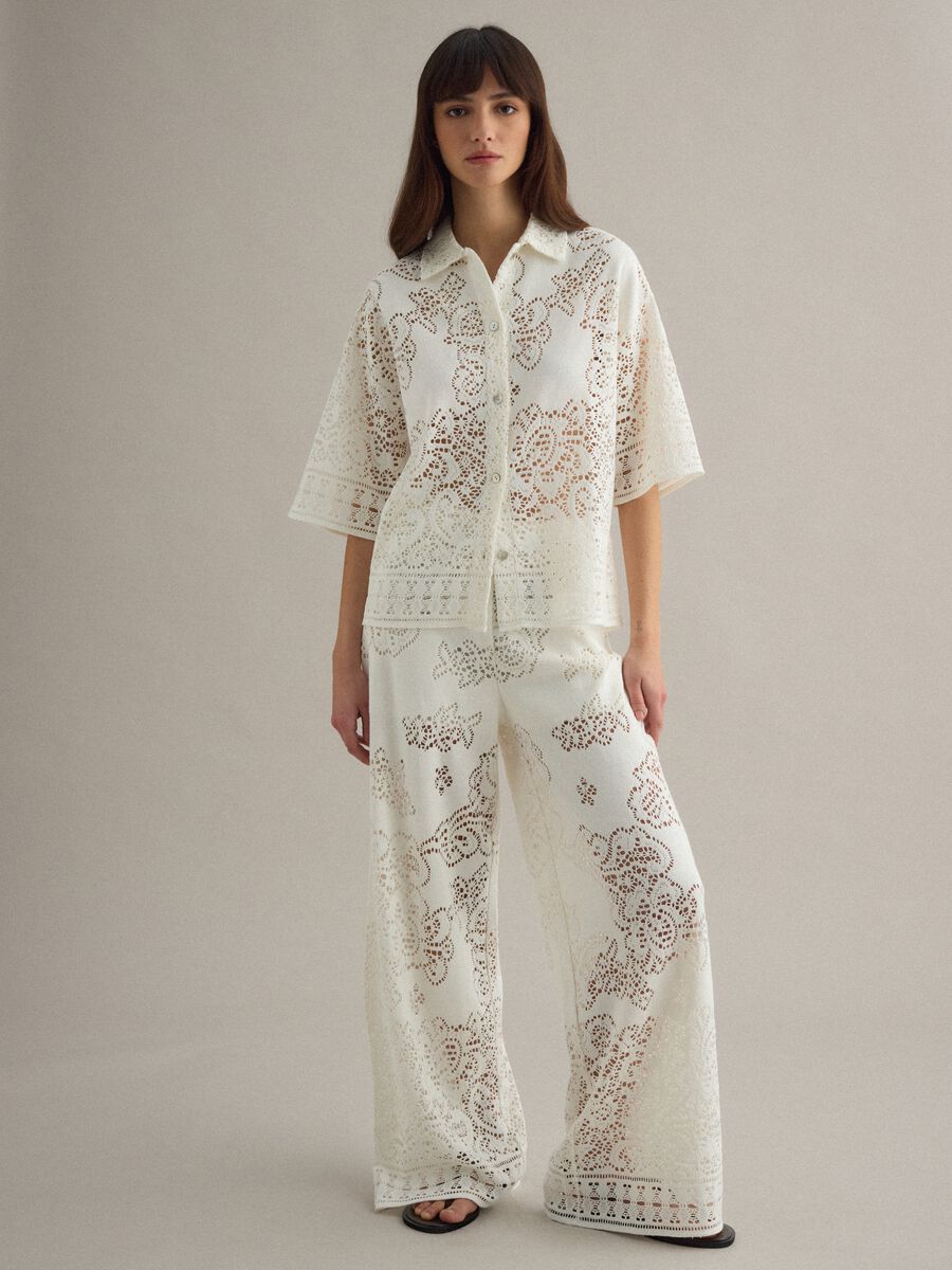 White wide leg cotton blend trousers with perforated texture_1