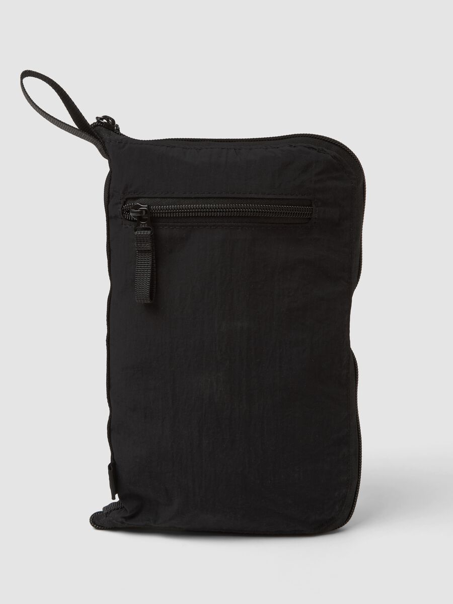 Black foldable travel bag with shoulder strap and zipped pockets_1