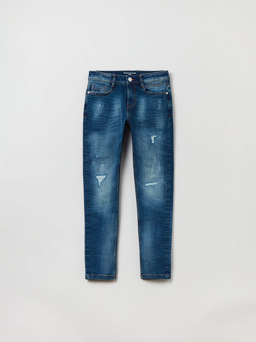 Slim-fit jeans with five pockets and abrasions_0
